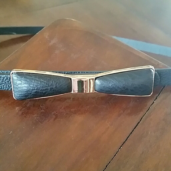 DONATING.  Bow detail belt