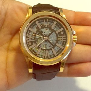 Bulova Accutron gold with brown leather band watch