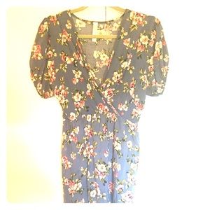Just above the knee length flower print dress.