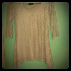 A DELICATE, CREAM LACE WITH A CAMISOLE BLOUSE