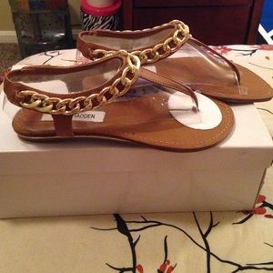 A pair of Steve Madden sandals.