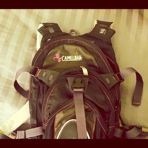 Pink and black camelbak backpack