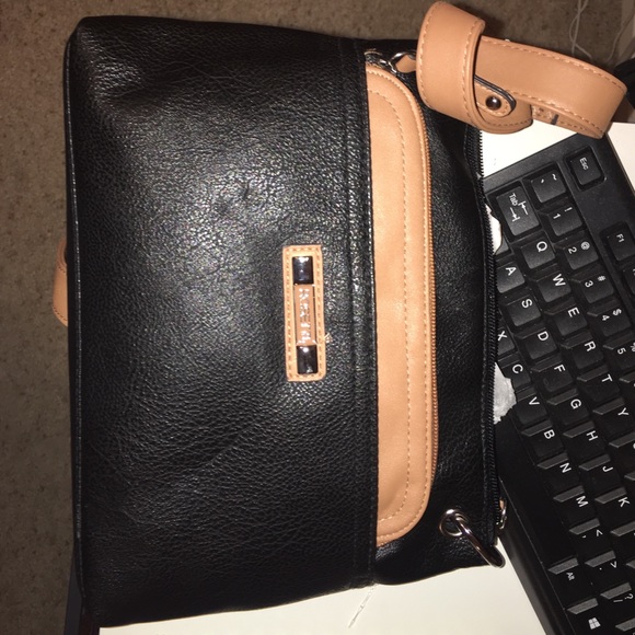 A small black Rossetti cross body bag