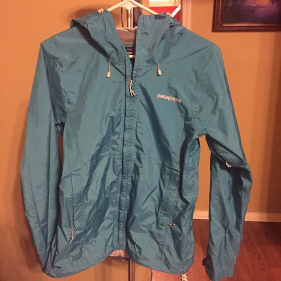 Teal blue Patagonia rain jacket.