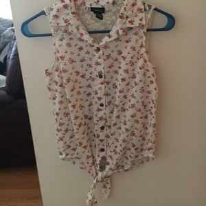 a floral shirt with lace on back