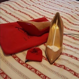Pointed beige Louboutin heels