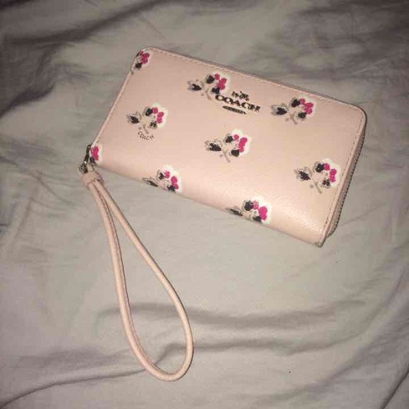 Coach floral wristlet. Minimal damage shown in pic
