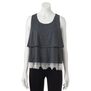 Mock- layer polka dot top with lace on bottom.