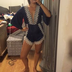 Adorable navy blue and white lace Romper. Medium