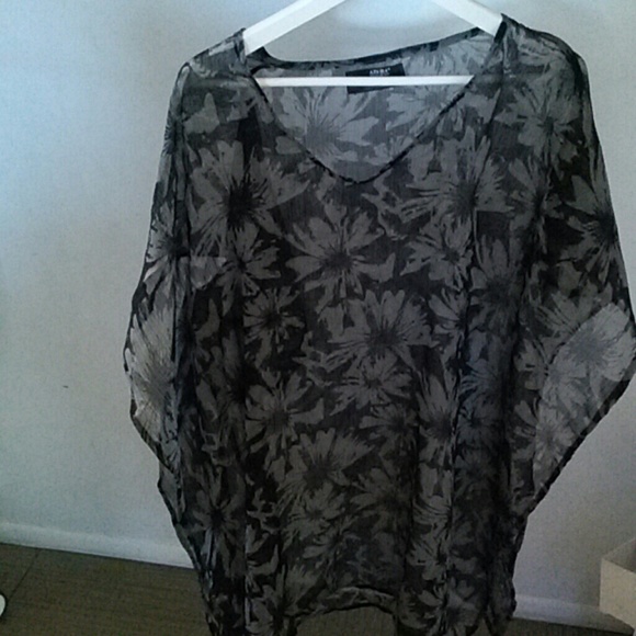 A grey and black sheer cover up.