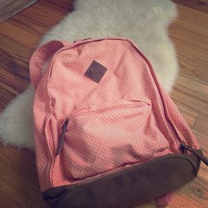 Polka dot peach colored book bag