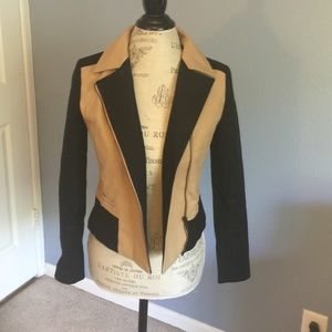 Tan and black jacket.