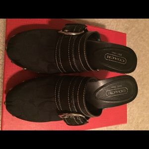 Coach signature fabric and leather clogs.