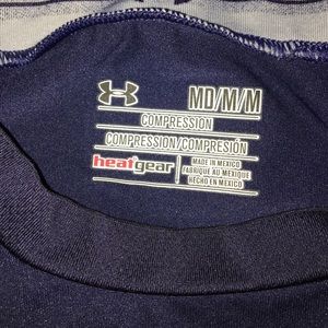 two sleeveless under armpit compression shirts