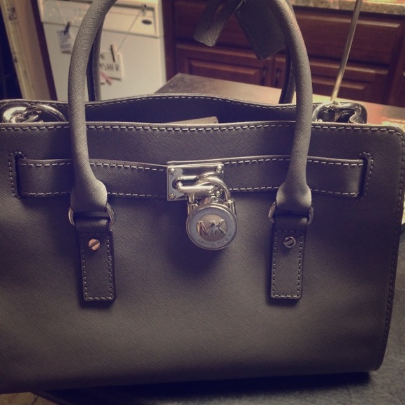 Grey Michael Kors purse.