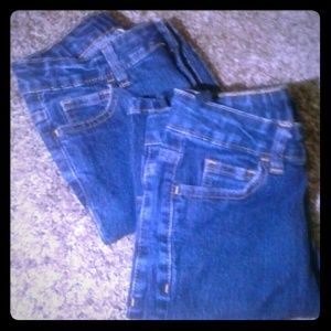 Two pairs of dark blue jeans