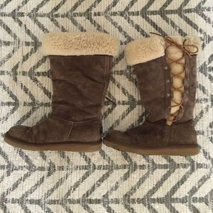 Brown lace up Uggs.