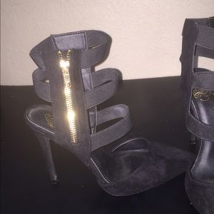 Faux suede black pointy toe heel with gold zipper