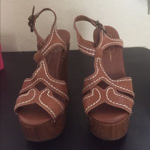 Wooden clog heels with white stitching