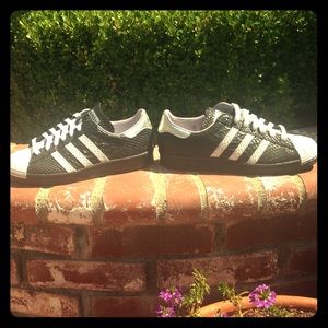 Brand new pair of Adidas sneakers, never worn.