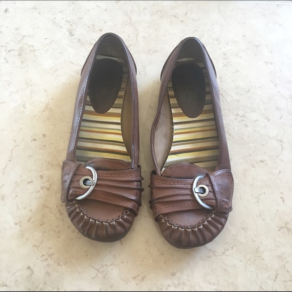 Brown buckle flats