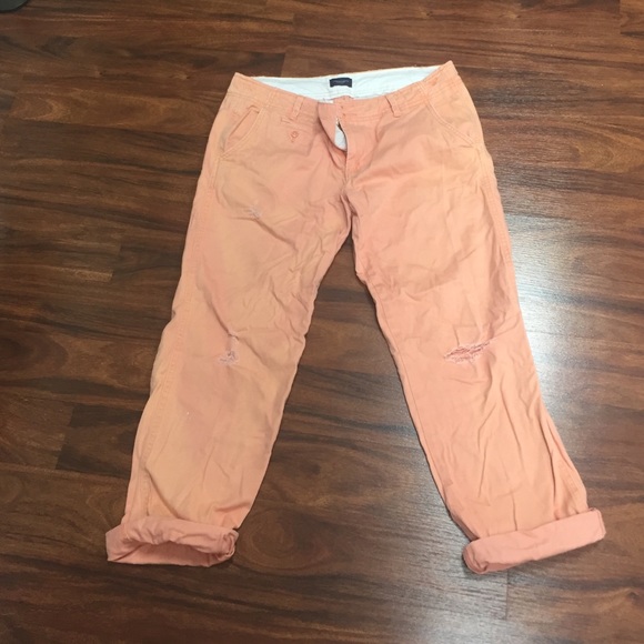 Salmon capris with ripped knee and rolled pant
