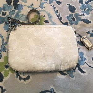 White and silver Coach wristlet. Brand new!