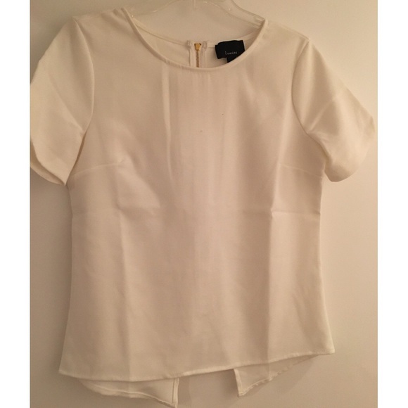 White top with zipper down the back