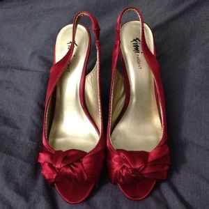 Red satin heels.