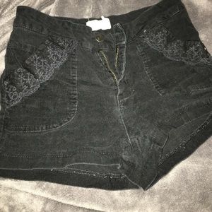 Black high-waisted corduroy style shorts