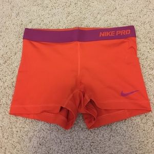 Orange Nike Pro shorts, size small