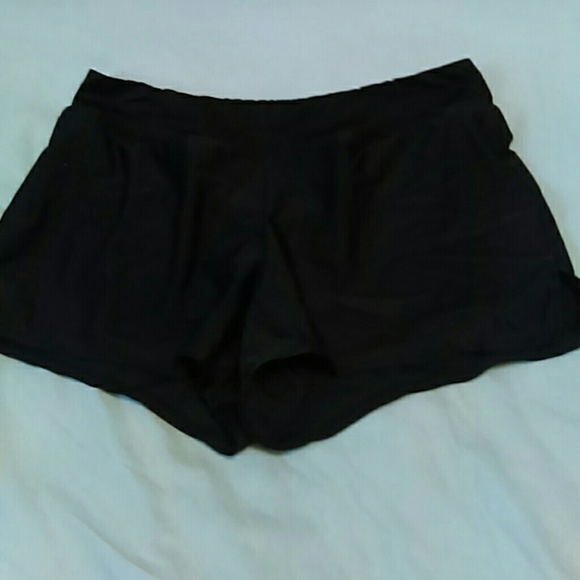 Boy shorts swim trunks. Never been worn.