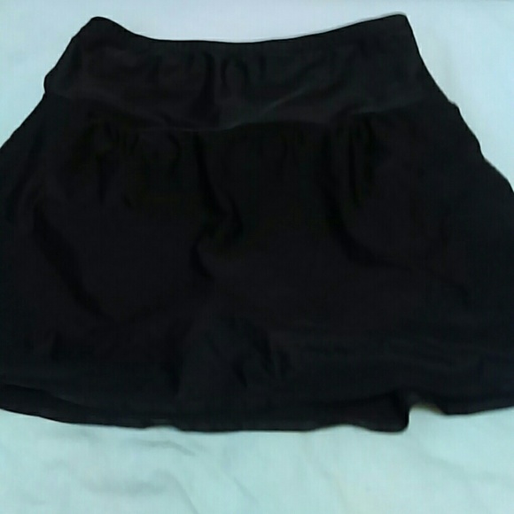 Black skirt swim bottom.  Elastic waist.