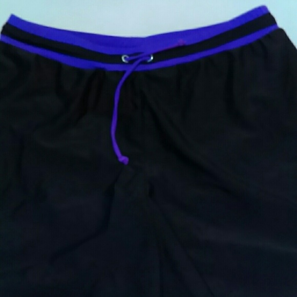 Swim shorts with purple ties.  Good shape.