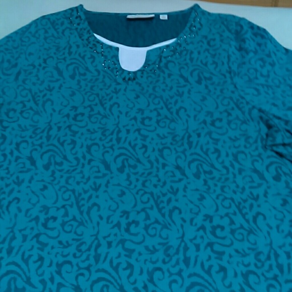 Beautiful top with a little white cover by chest.