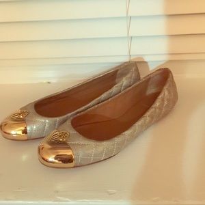 You need these Tory Burch casual gold shoes!