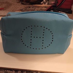 Mini baby blue Hermes makeup bag