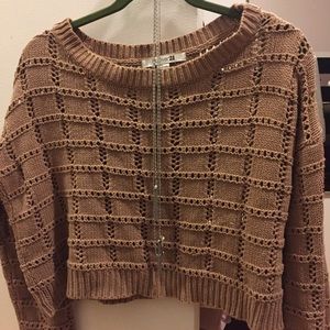 Cropped light brown sweater.
