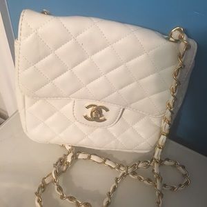 White quilted cross body bag with gold chain