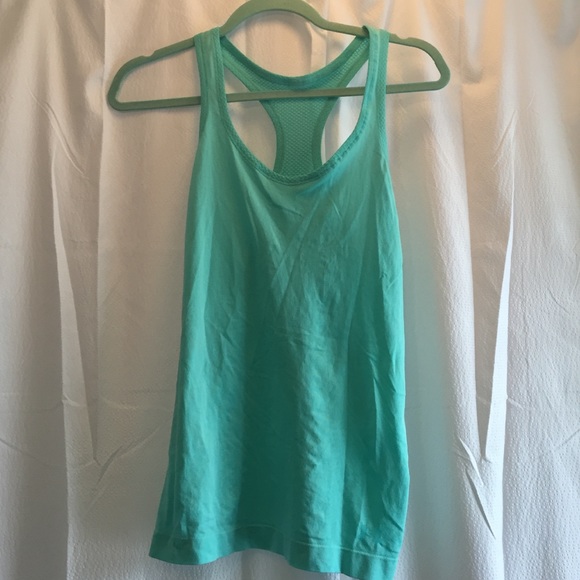 Under armor, blue tank top.