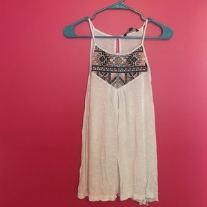 White tank top with embroidered top.