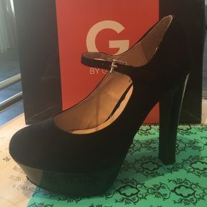 Black suede Mary Janes.