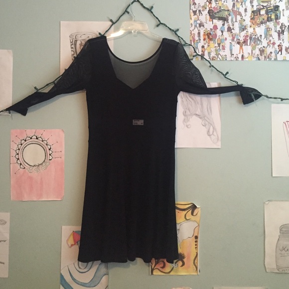 Black dress with mesh cutouts. NEVER WORN.