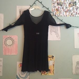 Black dress with mesh cutouts. NEVER WORN.