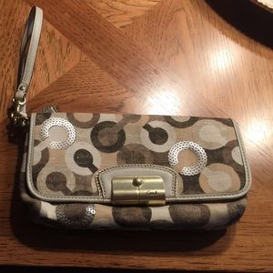 Brown, tan, cream Coach Wristlet