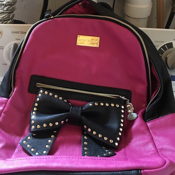 Betsey Johnson pink and black bow backpack.