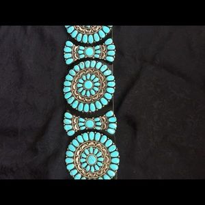 This is a genuine turquoise Concho/Butterfly belt.