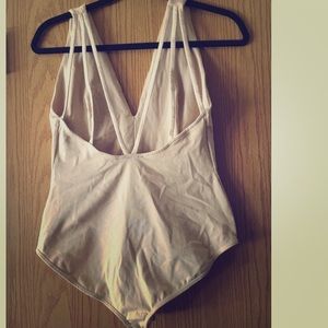 Brand new never worn nude deep v body suit