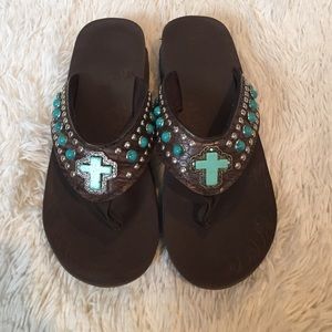 Brown and turquoise flip flops
