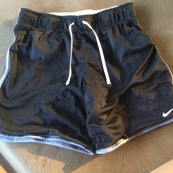 Black nike shorts .